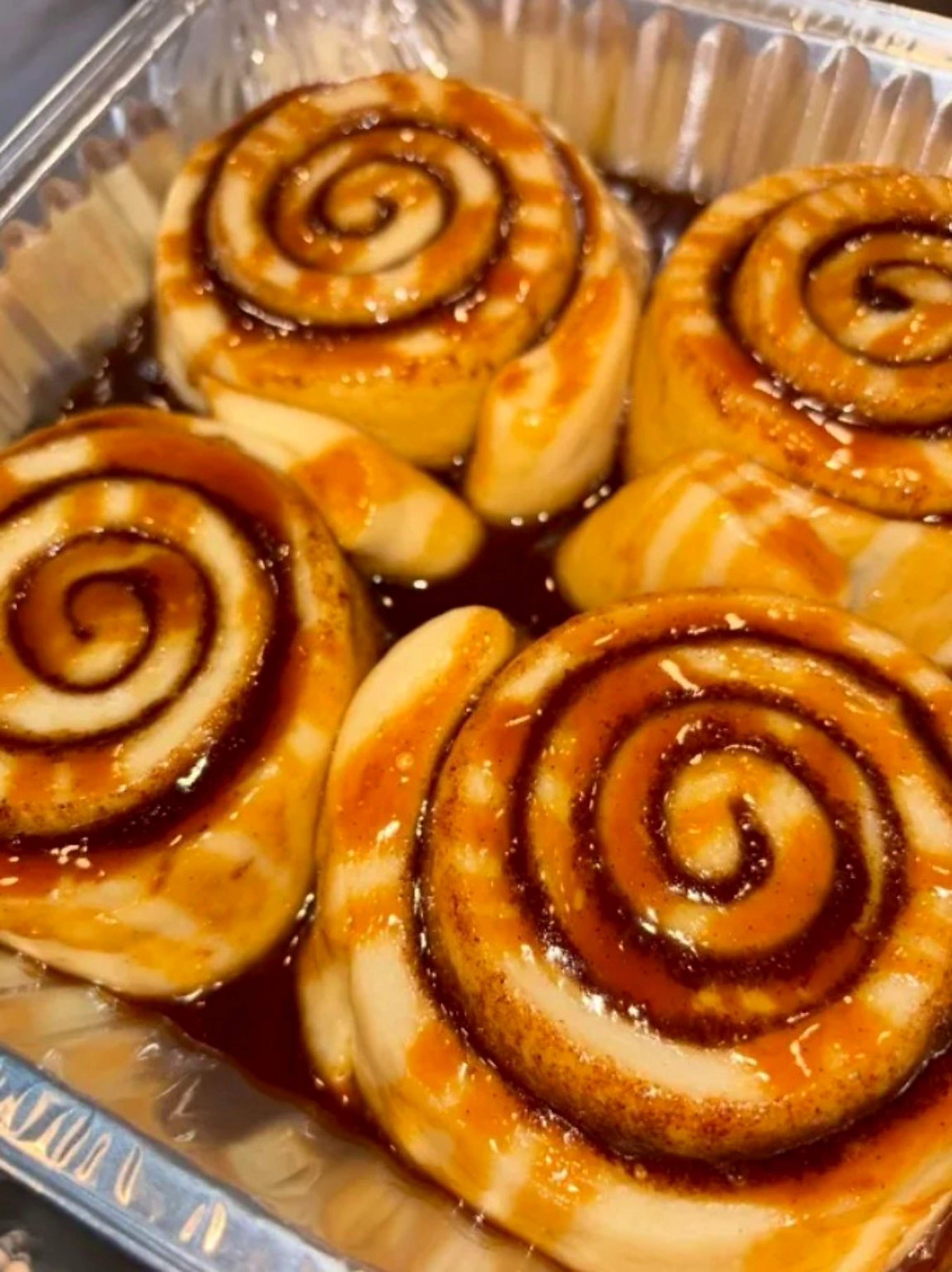 Freshly baked cinnamon rolls with a rich glaze