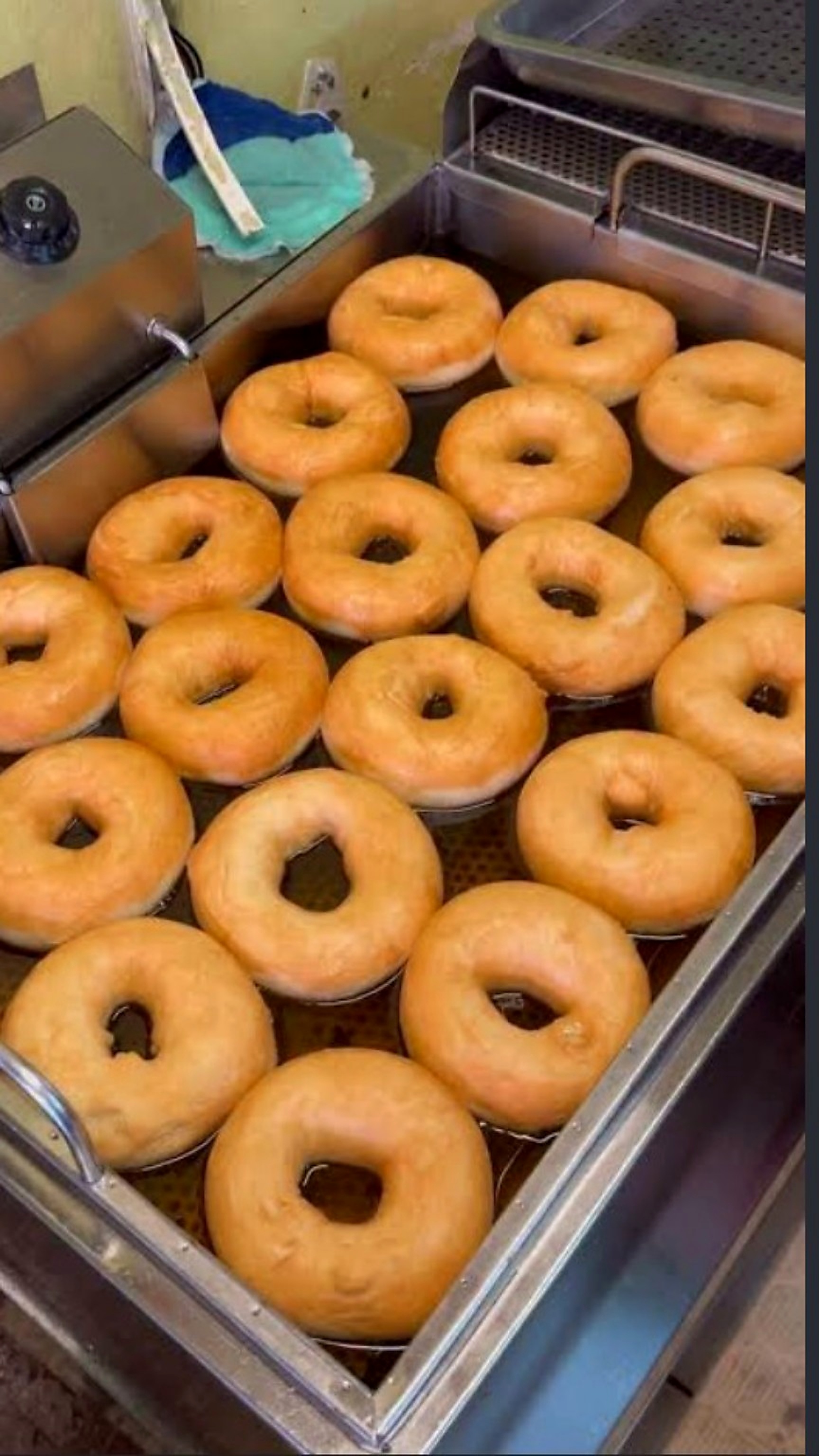 Golden freshly prepared doughnuts