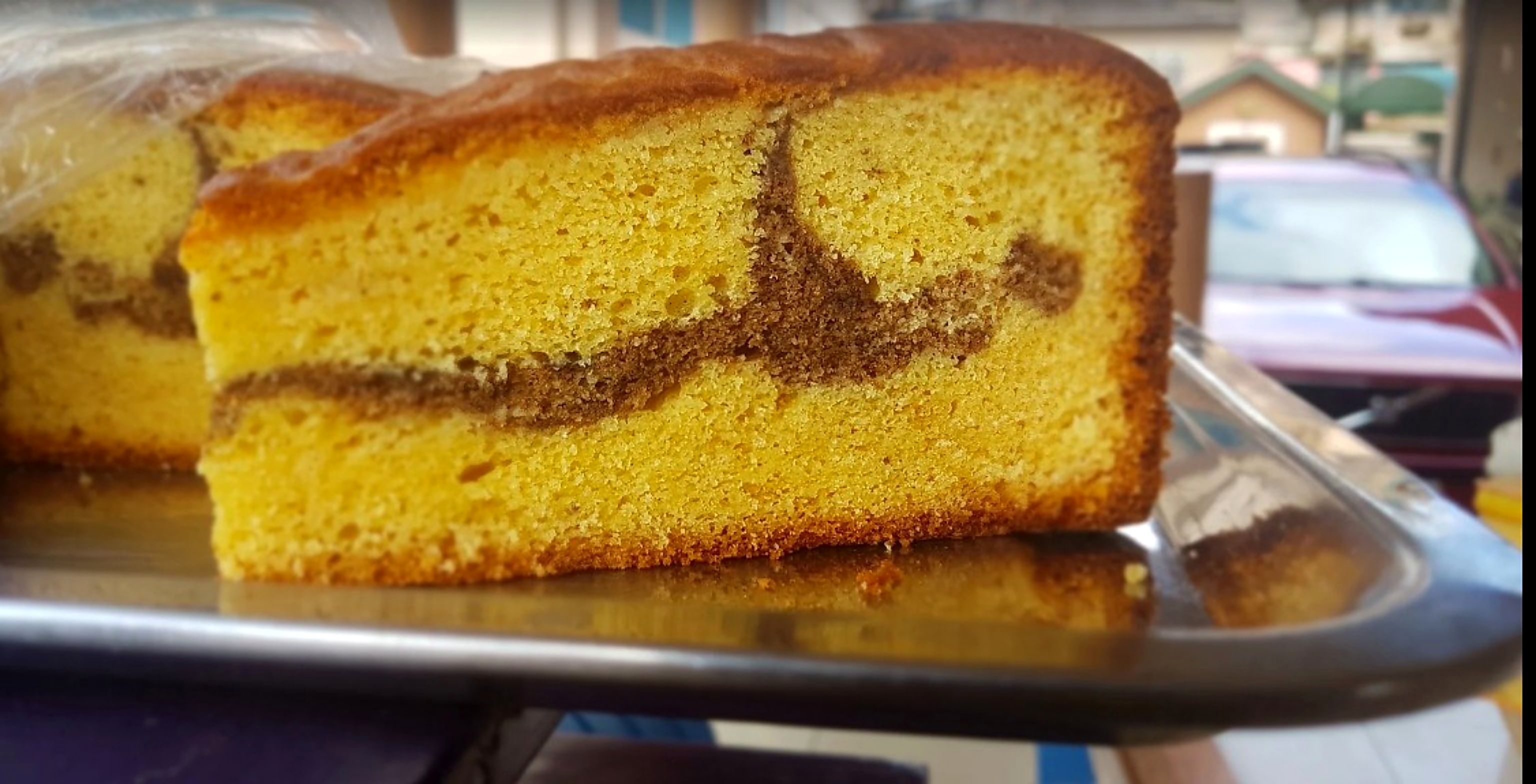 A slice of golden marble cake
